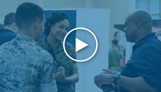 man and woman service members speaking with a prospective employer - video thumbnail