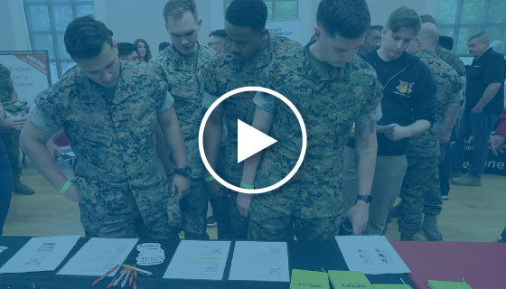 service members look at employment materials on a table - video thumbnail image